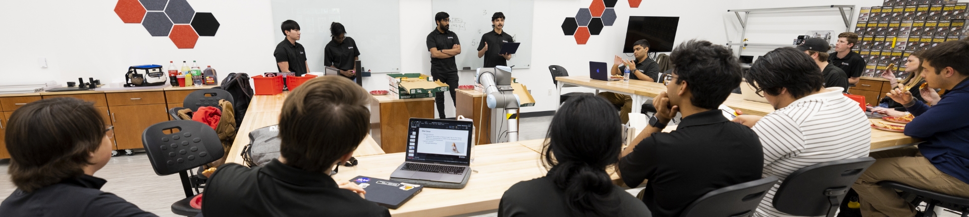 Students gathered in a room in a circle