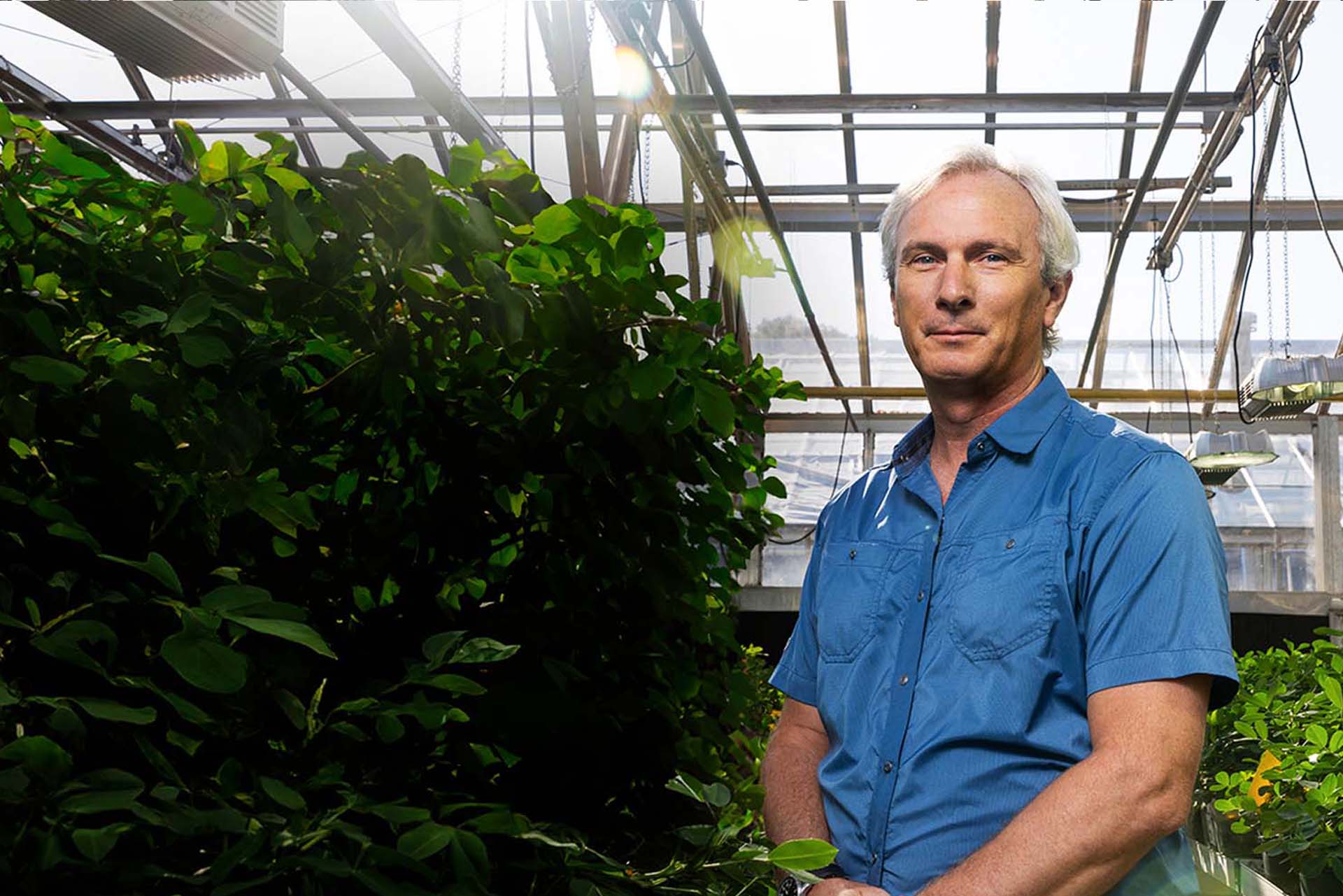 Scott Jackson standing in a greenhouse