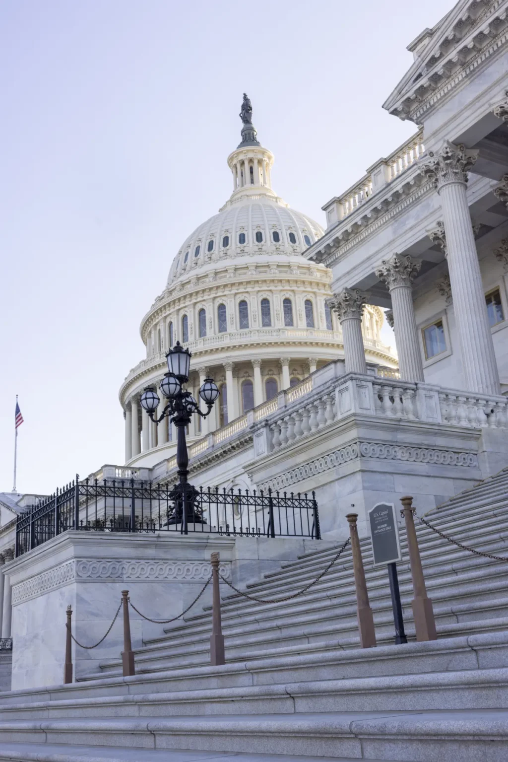 A closeup of stairs leading up to the U.S. Capitol Building which is all white.